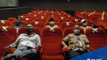Tips Aman Kembali Nonton di Bioskop saat PPKM